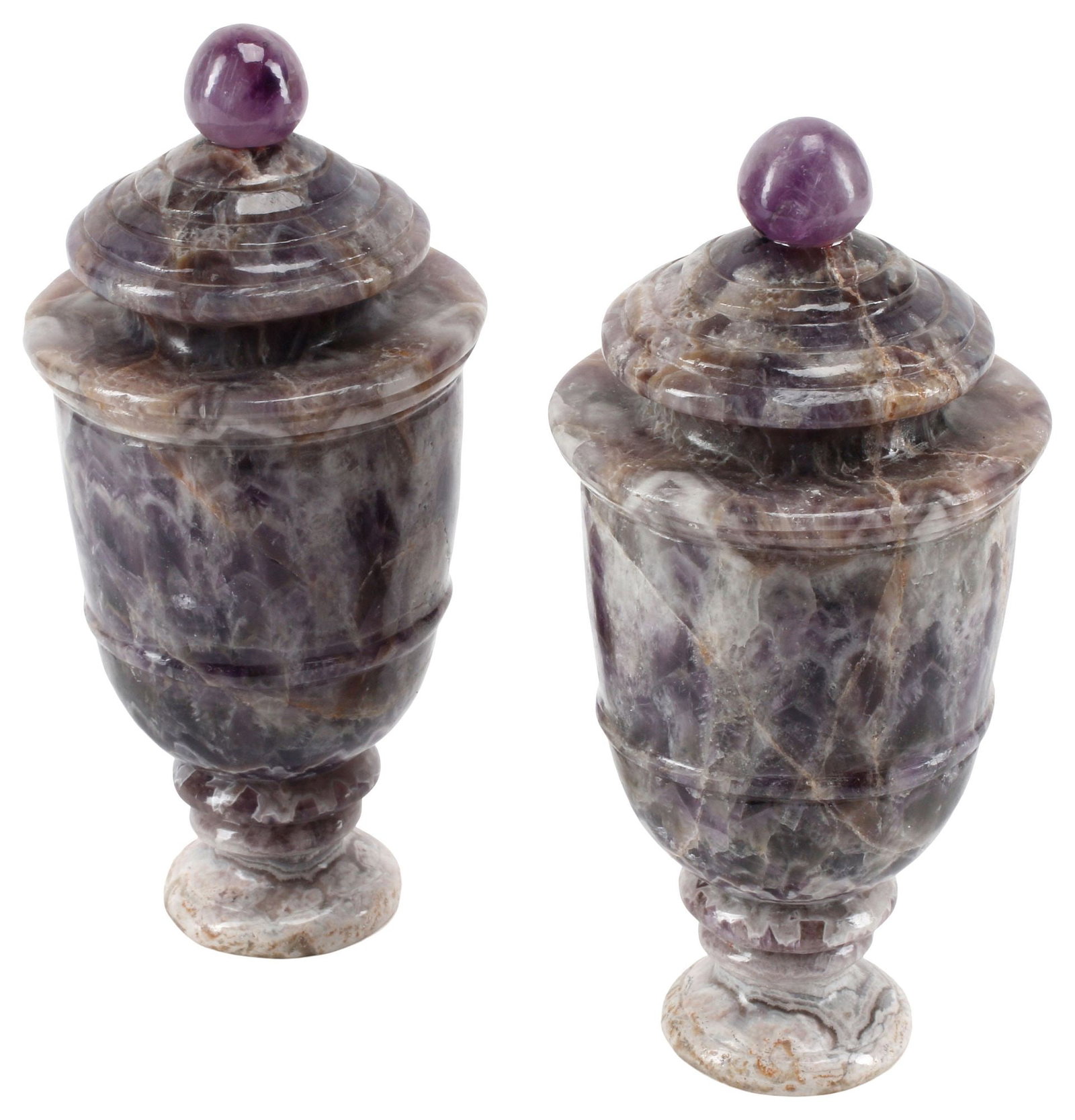 (2) NEOCLASSICAL STYLE BANDED PURPLE HARDSTONE URNS: (pair) Neoclassical style banded purple hardstone urns, possibly amethyst, each on small circular pedestal foot, (one) glued repair to ball finial approx 9"h, 4"diam, 9.75lbs