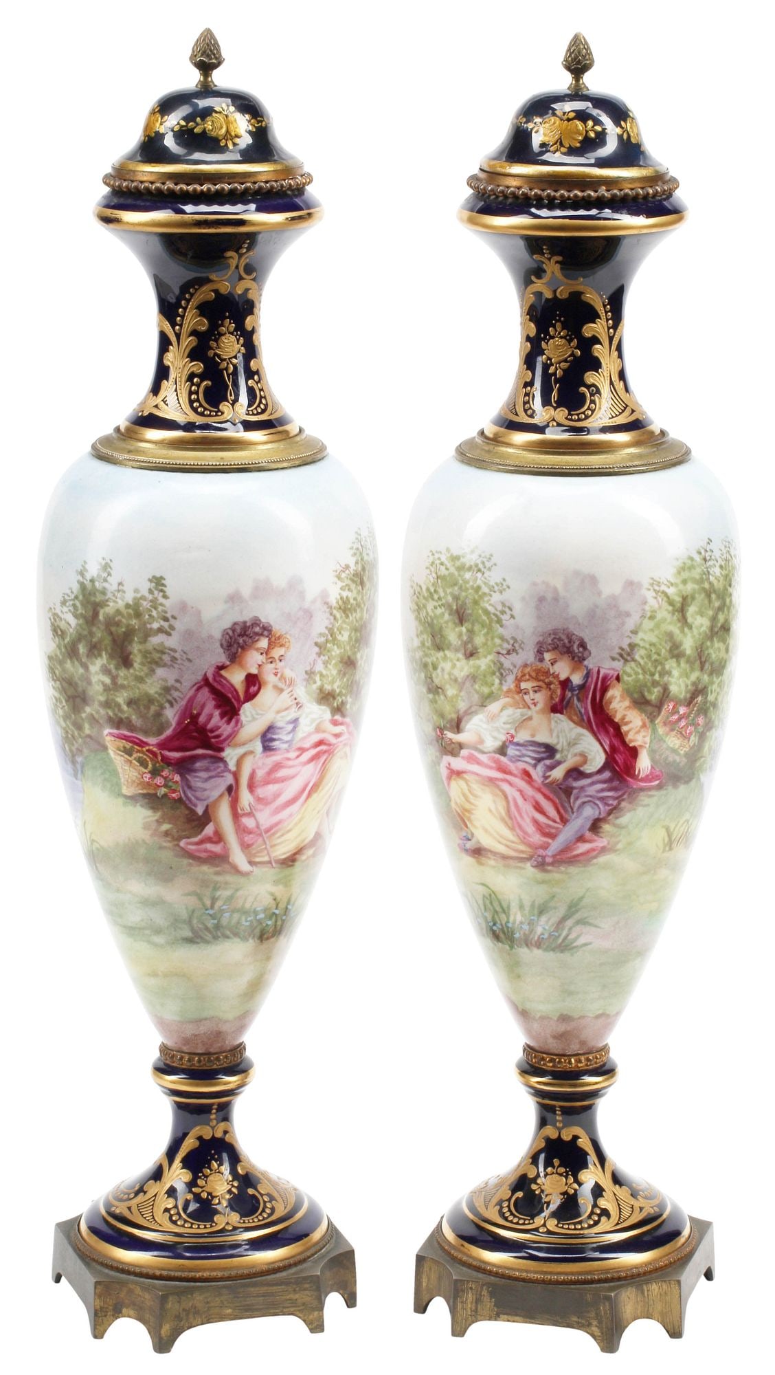 (2) FRENCH SEVRES STYLE PARCEL-GILT PORCELAIN VASES & COVERS: (pair) French Sevres style porcelain covered vases, 19th c., each with parcel-gilt scrollwork on cobalt ground, hand-painted reserves depicting courting couples in verdant landscapes, signed Lirvad,