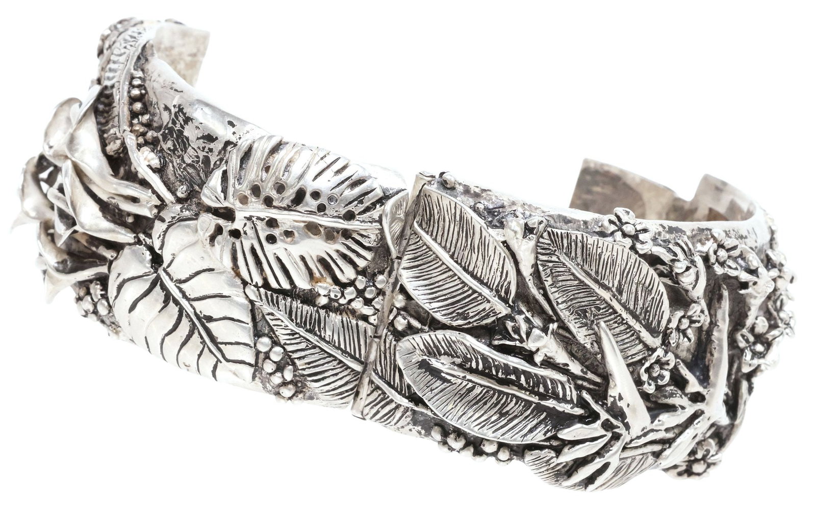 EMILIA 'MIMI' CASTILLO (B.1958) TAXCO MEXICO .950 SILVER CUFF BRACELET: Estate .950 silver "Flowers in Paradise" hinged cuff bracelet, signed Mimi Castillo (Emilia "Mimi" Castillo, Taxco, Mexico, b.1958), wide band with overlapping flowers and foliate motifs in high