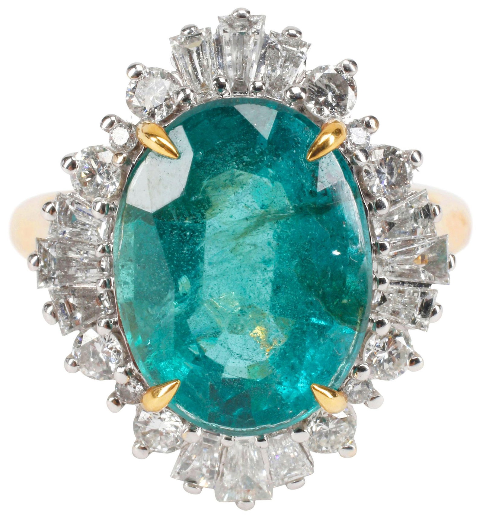 ESTATE BI-COLOR 18KT GOLD, 5.00CT EMERALD & DIAMOND HALO COCKTAIL RING: Estate bi-color 18kt yellow gold (tested) and gemstone cocktail ring, central mount holding an oval-cut Zambian emerald, approx 5.00cts, in a halo surround of (twenty-four) round and tapered baguette