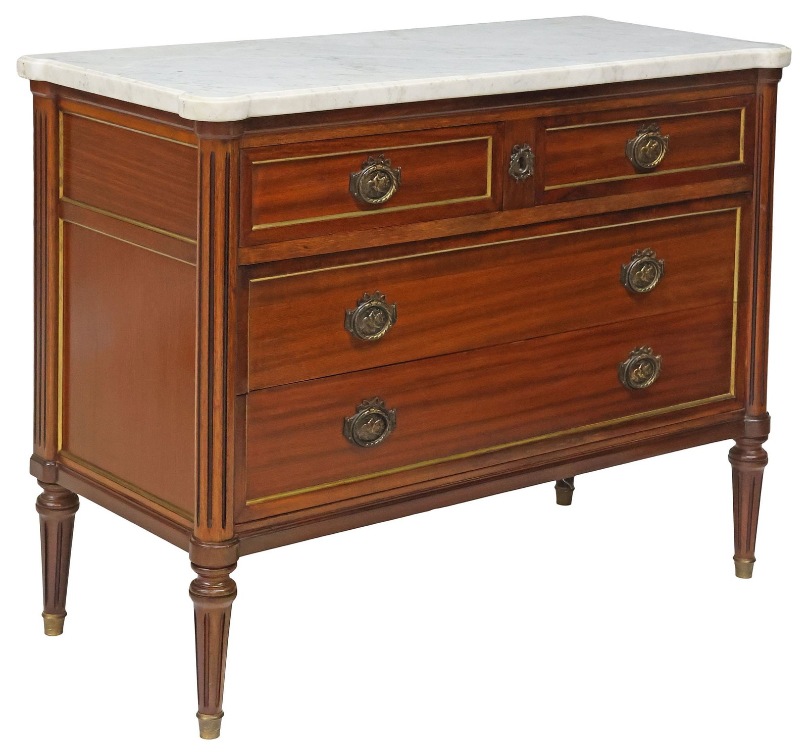 FRENCH LOUIS XVI STYLE MARBLE-TOP MAHOGANY COMMODE: French Louis XVI style mahogany commode, early 20th c., having shaped marble top, over two short drawers, and two long drawers, gilt-metal banded trim, rising on tapering fluted legs, ending on brass