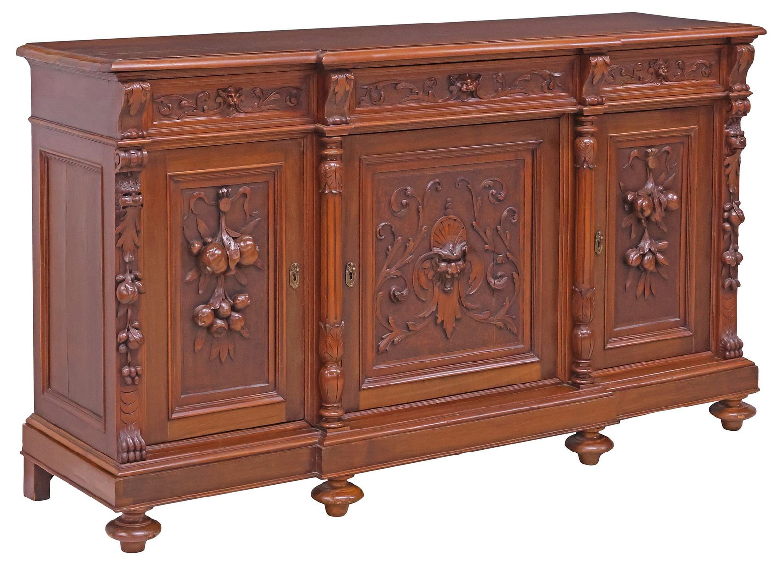 ITALIAN RENAISSANCE REVIVAL CARVED WALNUT BREAKFRONT SIDEBOARD: Italian Renaissance Revival carved walnut sideboard, late 19th c., breakfront case fitted with three drawers, above three paneled cabinet doors, revealing fixed-height shelving, flanked by fluted