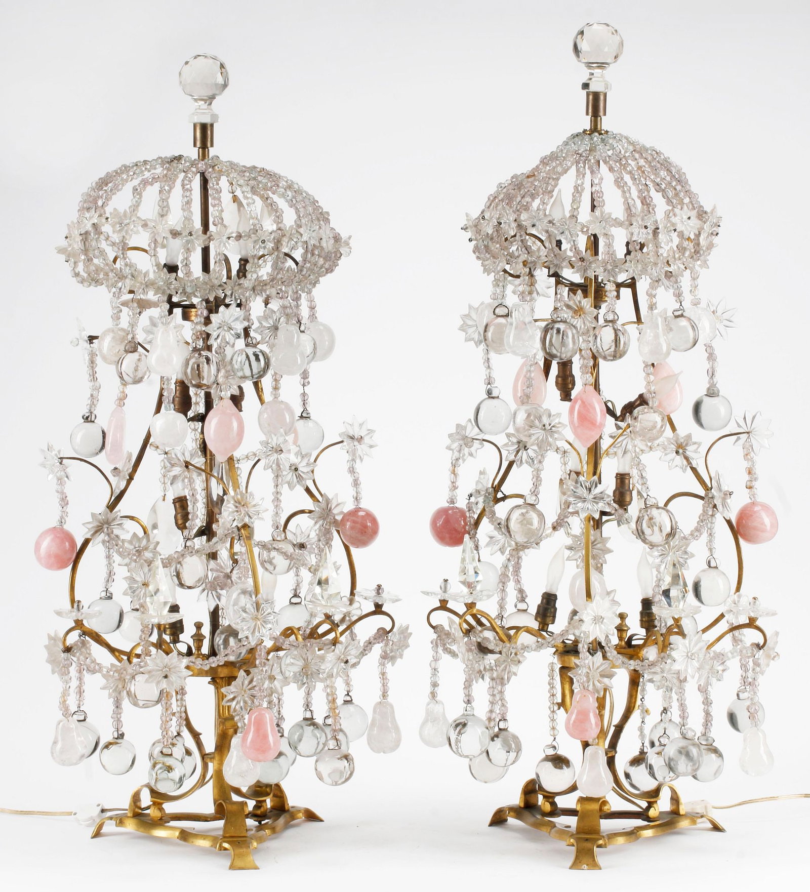 (2) LOUIS XV STYLE ORMOLU, CRYSTAL & ROSE QUARTZ GIRANDOLE LAMPS, 35"H: (pair) Louis XV style bronze dore, crystal, and rose quartz girandole table lamps, each having faceted finial and bead-clad dome, over scrolled frame hung with spherical drops and floriform beads, on 