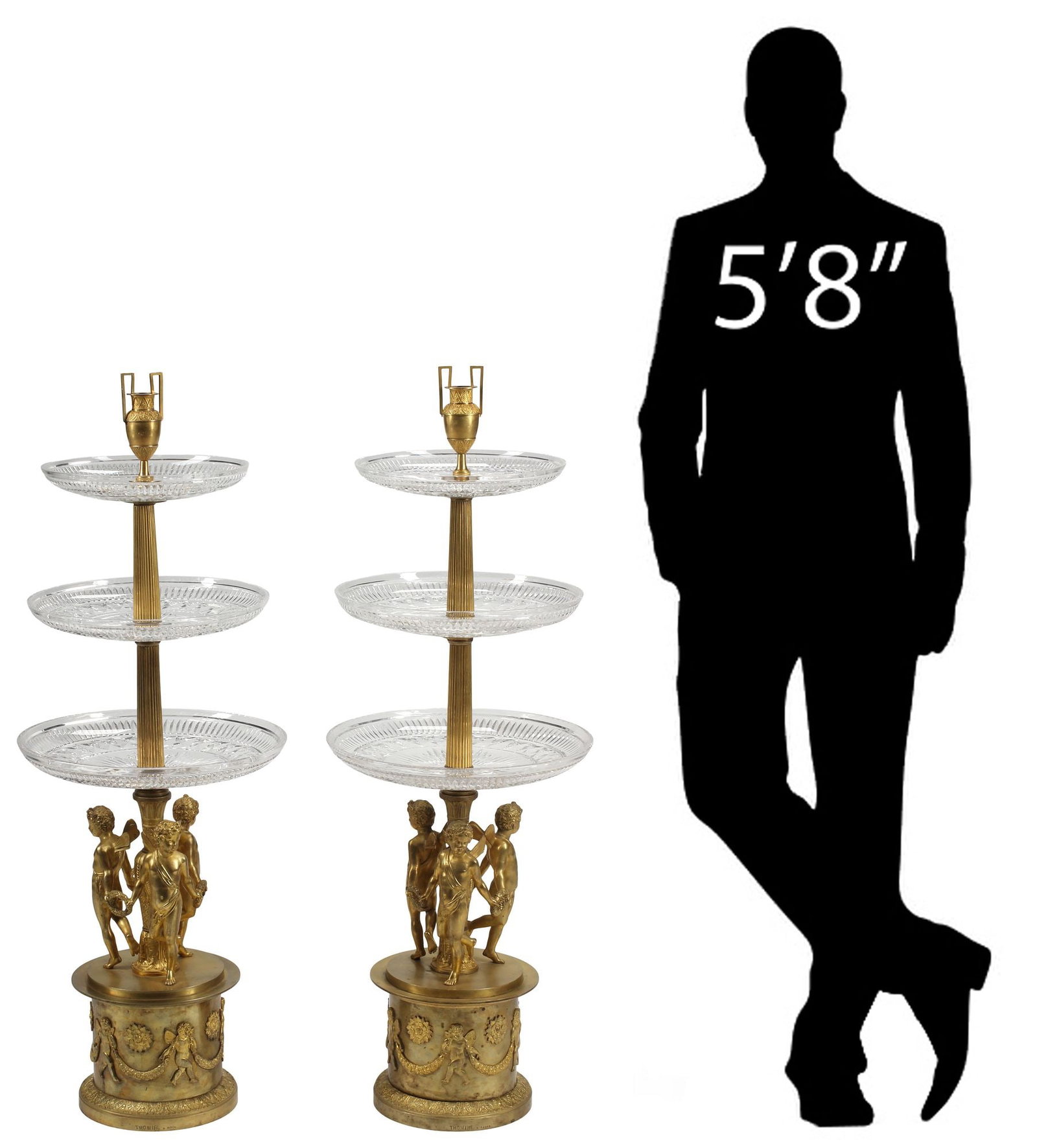 (2) PIERRE THOMIRE (FRENCH, D.1843) ORMOLU & CRYSTAL CHERUB ETAGERE CENTERPIECES, 44"H: (pair) Large bronze dore and cut crystal tiered etageres/ centerpieces, signed in cast Thomire (Pierre-Philippe Thomire, French, 1751-1843), each surmounted by an amphora-form finial, above three grad