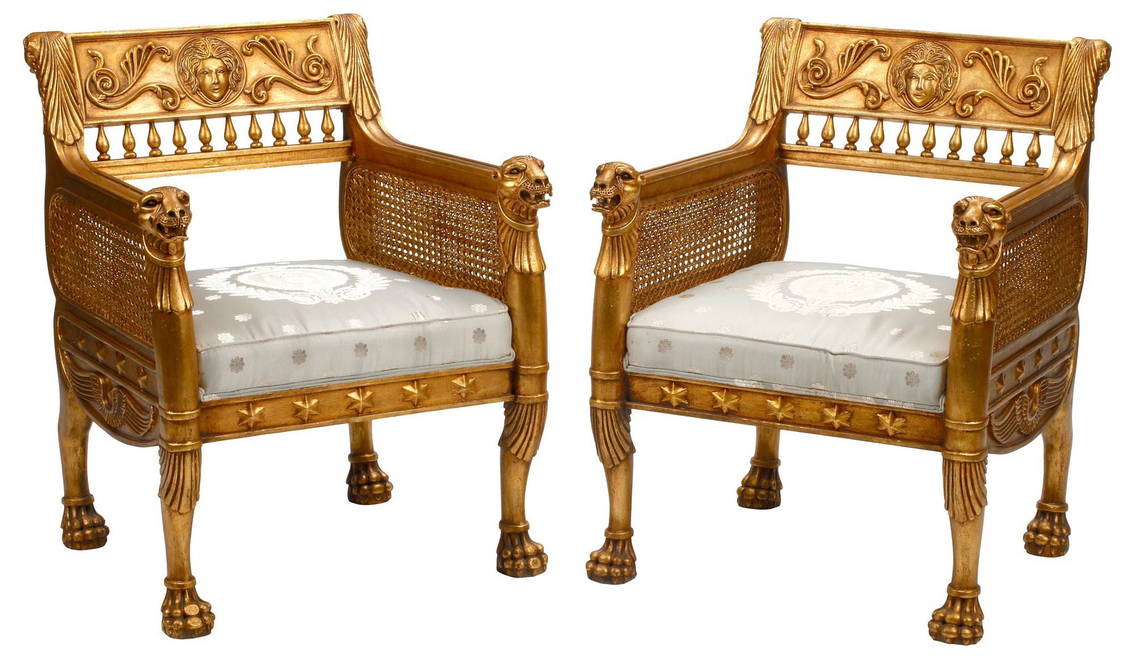 (2) NEOCLASSICAL STYLE CANED & SILK-UPHOLSTERED GILT ARMCHAIRS: (pair) Neoclassical style gilt armchairs, each having spindled back with figural mask motif, caned side panels, over padded seat in a silk upholstery, rising on paw feet, approx 35"h, 28"w,