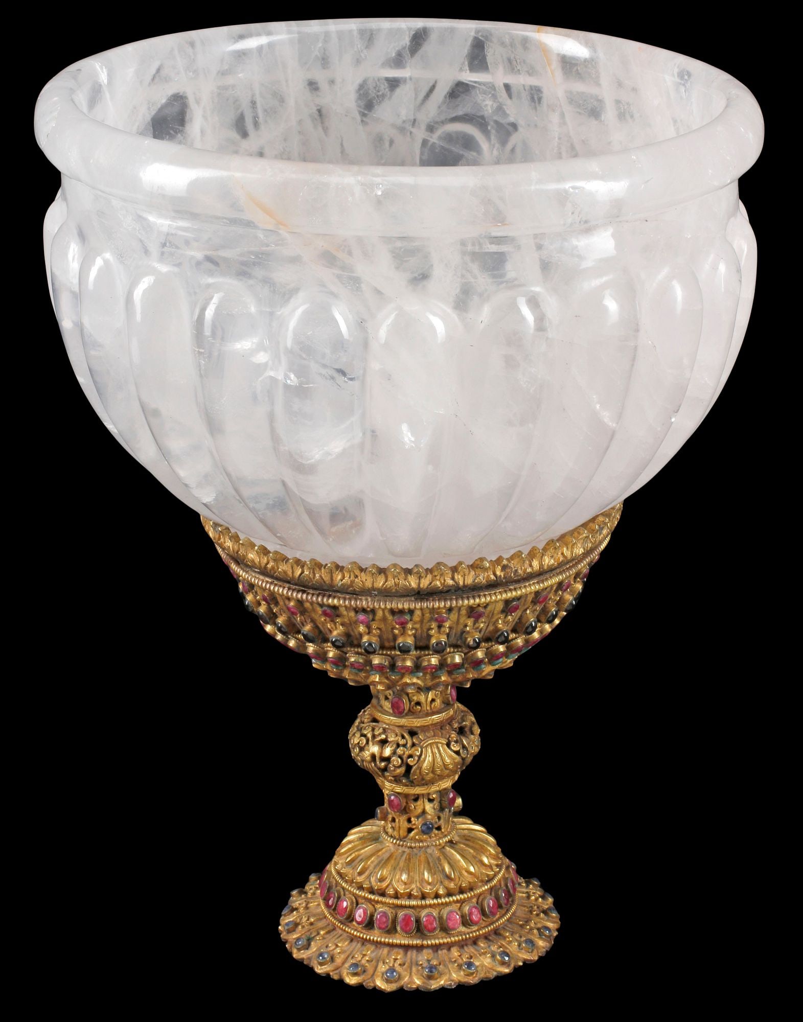 CARVED ROCK CRYSTAL CENTERPIECE BOWL ON ENCRUSTED ORMOLU STAND, 16"H: Large carved rock crystal gadrooned centerpiece bowl, rising on gilt-bronze pedestal encrusted with ruby and emerald, approx 16"h, 12"diam, 25lbs