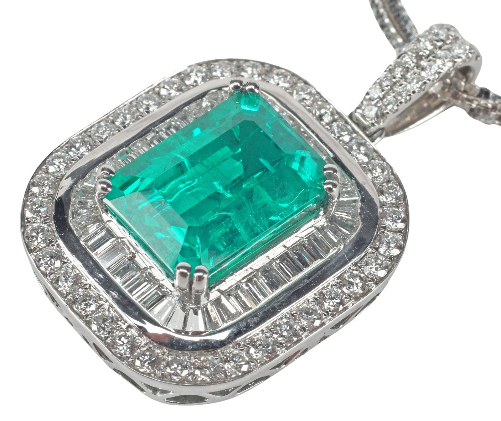 ESTATE 18KT WG 4.00CT EMERALD & 2.00CTTW DIAMOND PENDANT NECKLACE: Estate 18kt white gold pendant, featuring one (1) emerald, approx 4.00ct (see note below), surrounded by a double halo of baguette and round diamonds, approx 2.00cttw, average color: G-H, average clar