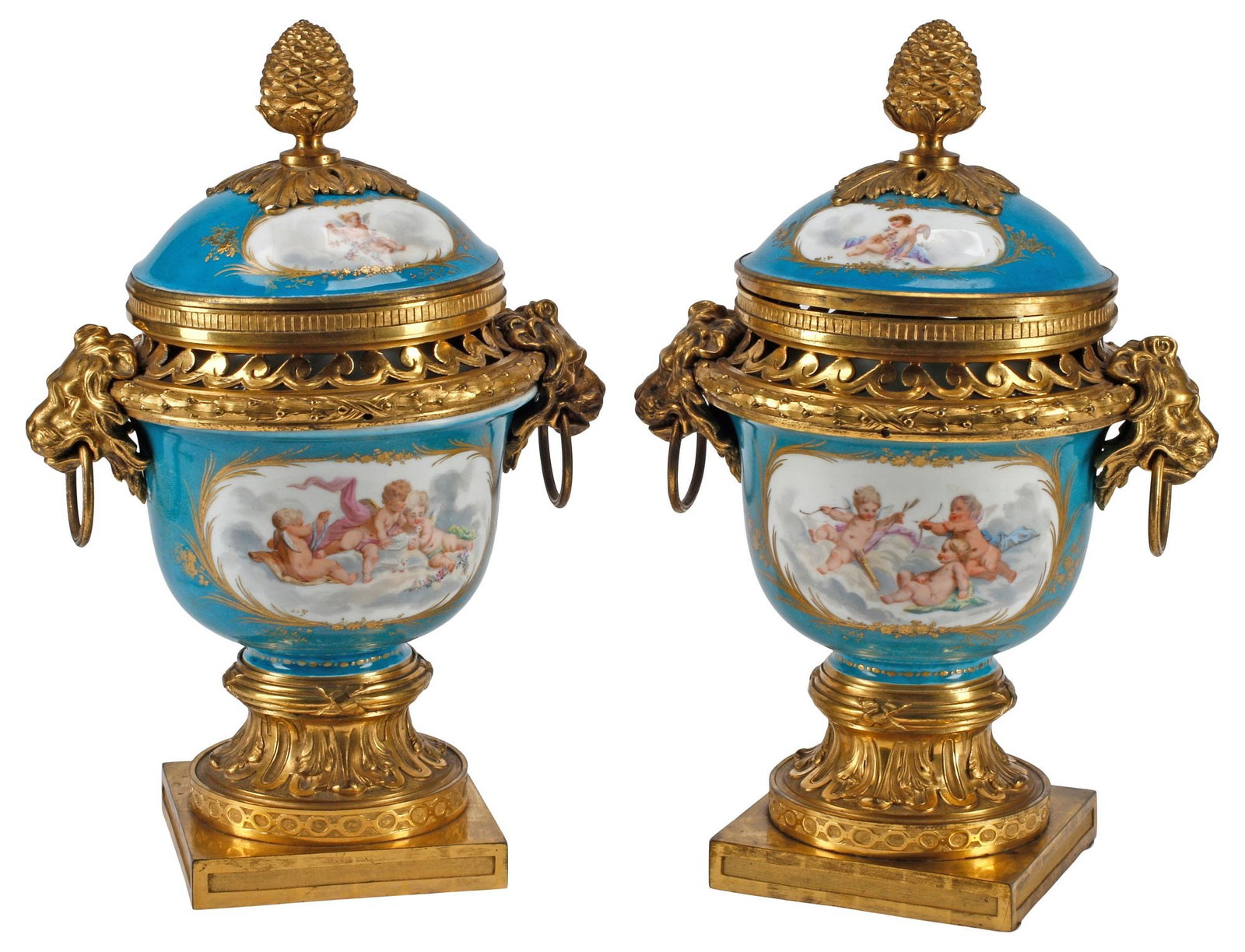(2) FRENCH SEVRES STYLE ORMOLU-MOUNTED PORCELAIN POTPOURRI VASES: (pair) French Sevres-style parcel-gilt porcelain potpourri vases, 19th c., each with bronze dore mounts, dual lion mask handles and pierced scrollwork border, over reserves with draped cherubs in cele