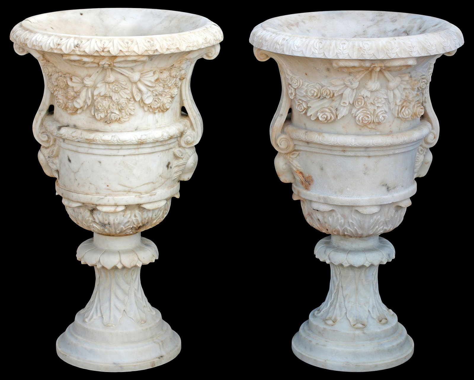 (2) NEOCLASSICAL STYLE CARVED WHITE MARBLE GARDEN URNS, 32"H: (pair) Neoclassical style carved marble garden urns/ planters, each having vasiform body with floral bouquets and foliate motifs, rising on integral waisted socle, approx 32"h, 19.5"diam**PLEASE NOTE: