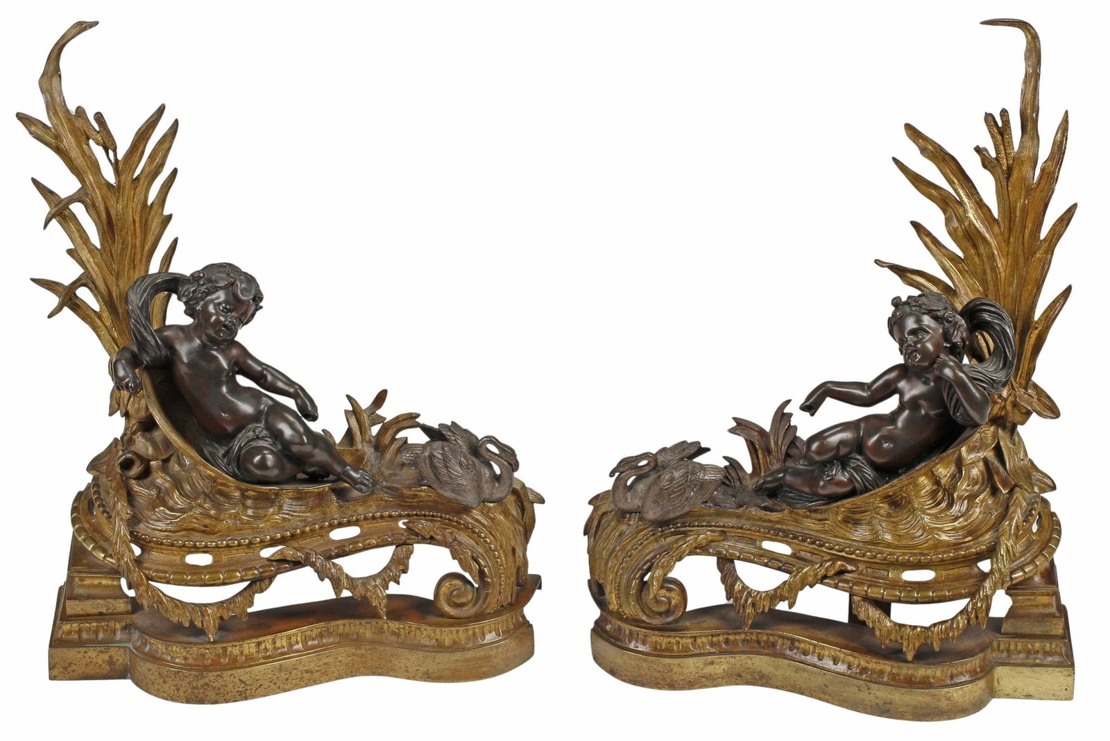 (2) FRENCH ORMOLU & PATINATED BRONZE FIGURAL SWAN FIREPLACE CHENETS: (pair) French patinated and gilt-bronze fireplace chenets/ andirons, 19th c., each having raised foliate backsplash and reclining putti figure, seated beside a winged swan, on pierced base with draped