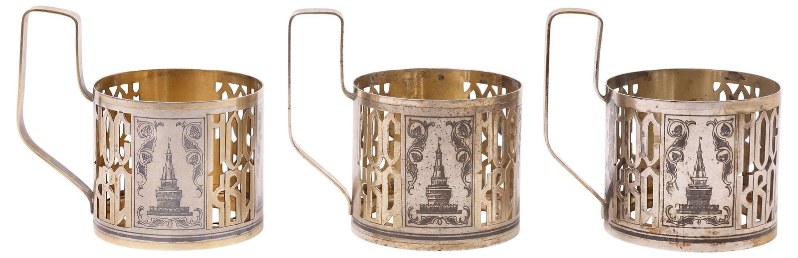 (3) RUSSIAN SOVIET UNION .875 SILVER NIELLO MOSCOW 'KREMLIN' CUP HOLDERS: (lot of 3) Russian Soviet Union .875 silver niello teacup holders, each having openwork panels inscribed "Moscow" in Cyrillic script, decorated with architectural facades from the Kremlin complex in