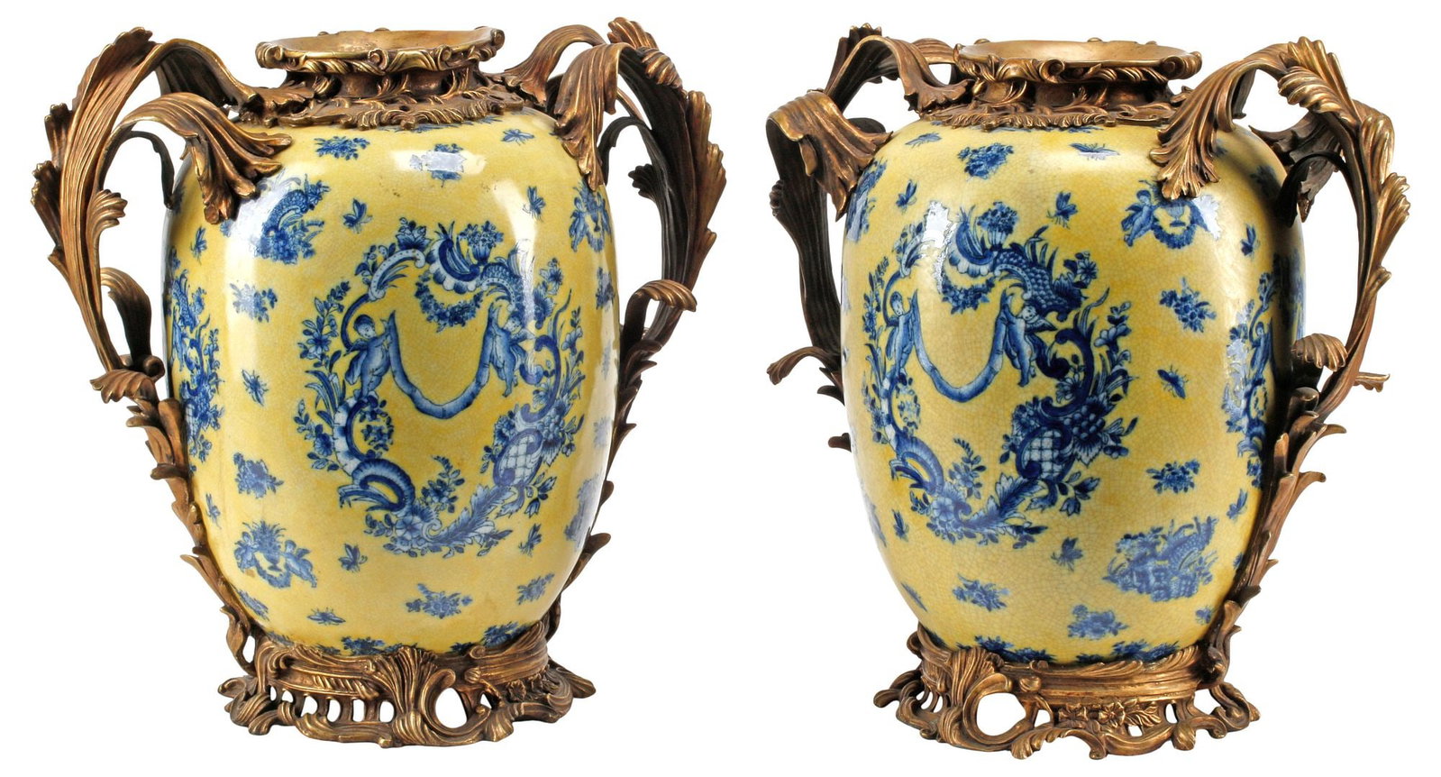 (2) LARGE UNITED WILSON ROCOCO STYLE BRONZE-MOUNTED PORCELAIN JARS: (pair) Large Rococo style porcelain jars with patinated bronze mounts, United Wilson Porcelain Factory, 20th c., ovoid form having a yellow ground with crackled glaze, decorated in blue with winged pu