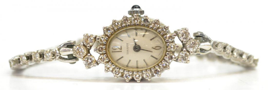 VINTAGE TISSOT 14KT GOLD & 1.95 CT DIAMOND WATCH: Vintage Ladies Tissot 1.95 ct diamond (total weight) and 14kt white gold watch containing: (20) single cut diamonds around the dial, approx. .03ct each, average clarity: VS1-VS2, average color: G-H; a