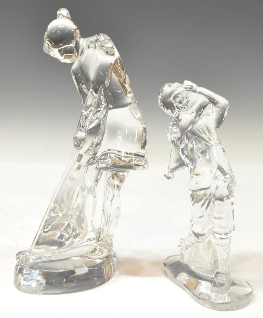 (2) BACCARAT & WATERFORD CRYSTAL GOLFING FIGURES: (lot of 2) Crystal figures,comprising: (1) Baccarat female golfer modeled in the putting stance, marked underfoot, approx 9"h, 4"w, 4.5"d; (1) Waterford male golfer, modeled in full swing, marked unde