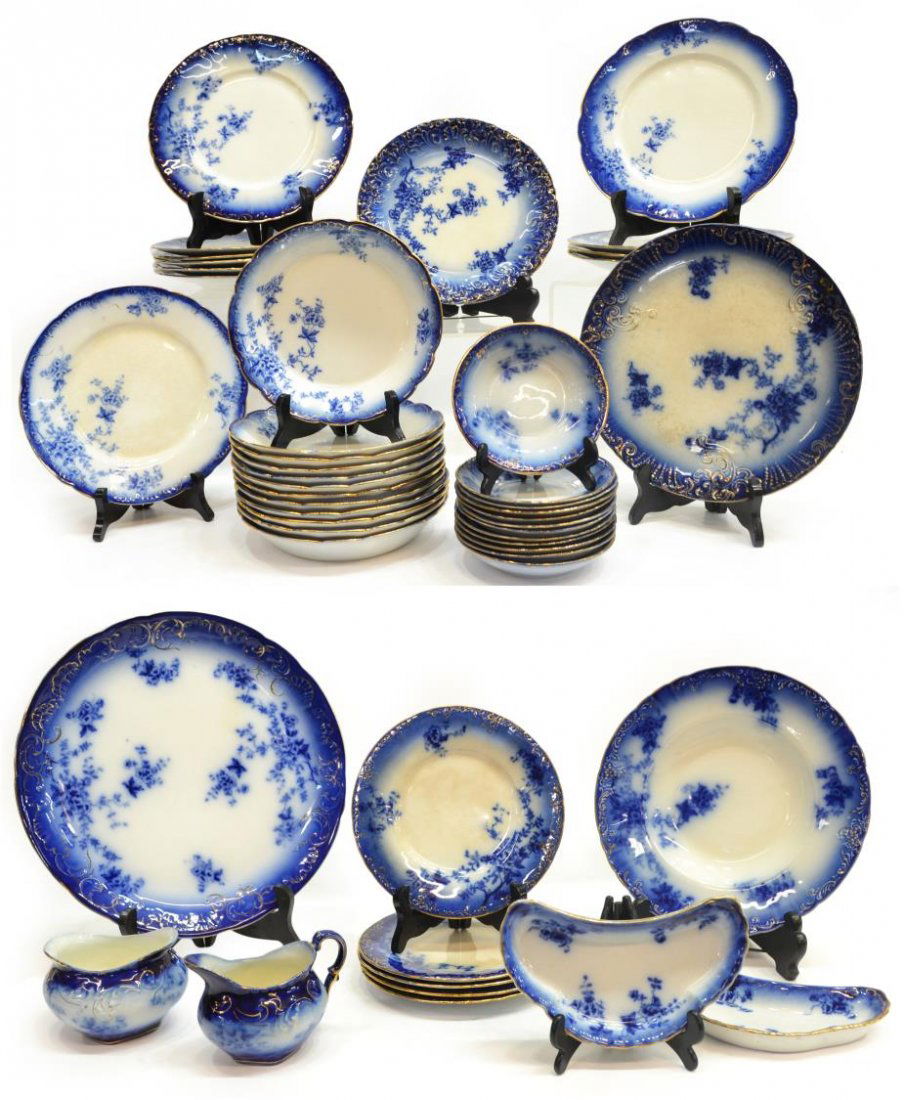 (48)WHEELING 'LA BELLE CHINA' FLOW BLUE DINNER SET: (set of 48) Wheeling Pottery parcel gilt 'La Belle China' flow blue dinner service, assembled with slightly varied designs, c. 1900, comprising: (1) dinner plate, varied mark, approx 10"diam; (4) dinn
