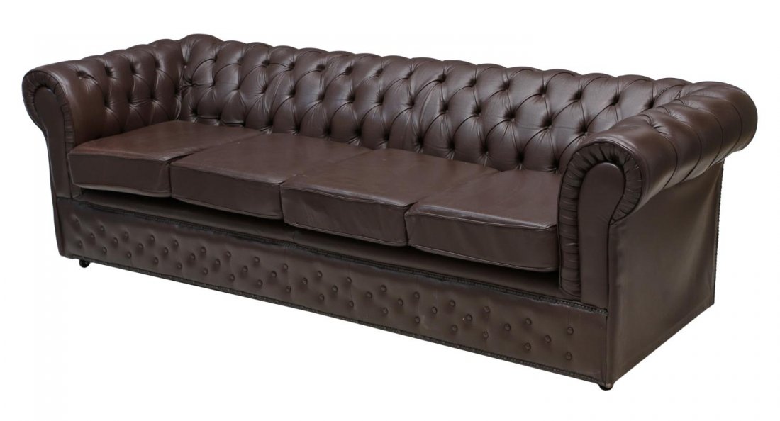 BRITISH CHESTERFIELD FOUR SEAT LEATHER SOFA: Chesterfield brown leather upholstered sofa, England, 20th c., buttoned and tufted back affixed with four seat cushions, resting on bun feet, 29"h, 90"w, 33"d Start Price: $600.00