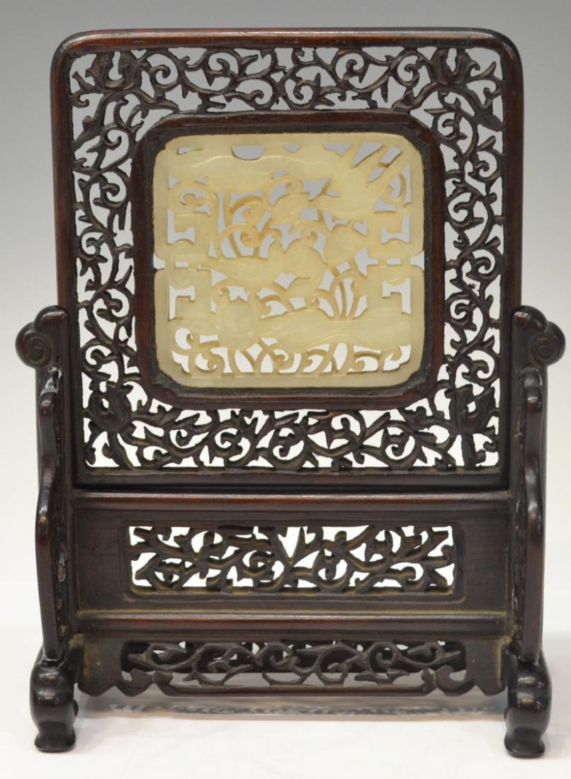 CHINESE RETICULATED WOOD & JADE TABLE SCREEN: Chinese reticulated wood two-section table screen, 20th c., centered by a pierced jade plaque featuring a lotus pond with birds, loss to pierced carving one side panel as pictured, overall: 7"h, 5"w, 