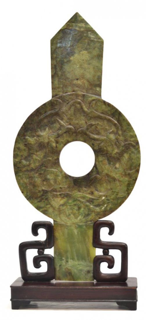 CARVED CHINESE NEPHRITE JADE PI SYMBOL: Carved Nephrite Jade Chinese Pi symbol with spear point, carved dragons, accompanied by restored wood stand, both sides at circle with visible lines, jade: 13"h, 6.5"w, housed in a fitted box, overall