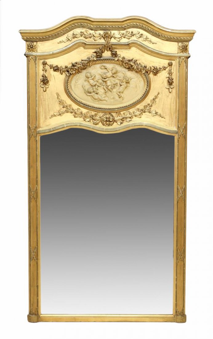 LARGE LOUIS XVI STYLE TRUMEAU BEVELED MIRROR: Louis XVI style gilt finish trumeau mirror with floral garland decoration, an arched cornice over a central reserve with playful putti, the beveled plate flanked by ribbed engaged columns, 75'h, 42.5"