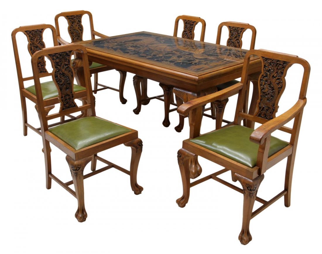 HIGHLY CARVED CHINESE DINING TABLE & CHAIRS: (set of 7) Highly carved Chinese dining suite, 20th, the table top carved in relief with a landscape battle scene of warriors on foot and horseback, the whole raised on paw feet, 31"h, 60"w, 35.75"d;