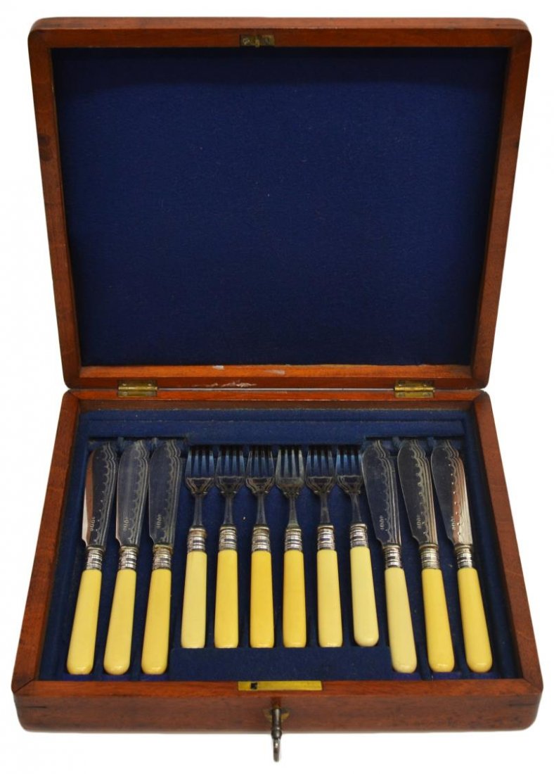 ANTIQUE CONTINENTNAL SILVERPLATE FISH SERVICE SET: (set of 12) Cased Continental fish service set, silverplate blades and tines engraved in a stitch pattern, fitted in a walnut case with sheild form brass cartouche and escutcheon, including: (6) indiv