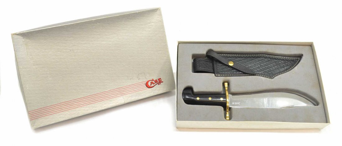 CASE XX BOWIE HUNTER KNIFE & SHEATH, ORIGINAL BOX: Case XX bowie hunter knife, black handle with brass guard, fitted in original box, accompanied by a patterned leather sheath, blade: 9.5"l, overall: 14.25"l, 2.25lbs Start Price: $60.00