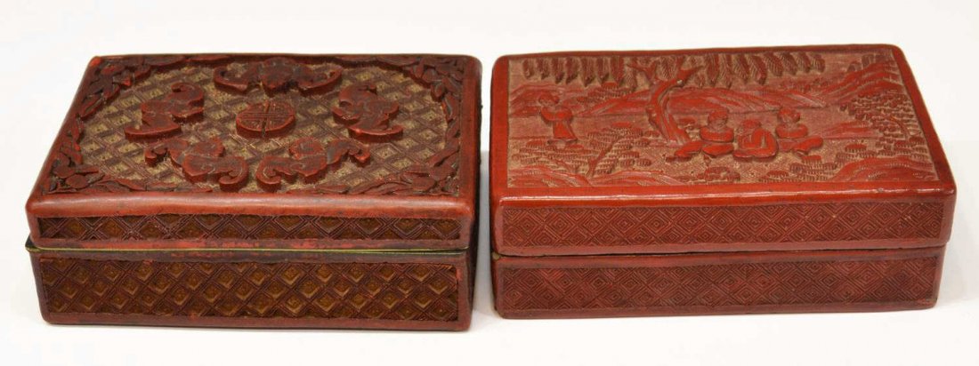 (2) CHINESE CARVED CINNABAR LACQUER TABLE BOXES: (lot of 2) Chinese carved cinnabar table boxes, comprising: (1) of rectangular form, the hinged top decorated with bats surrounding a shou character in relief, the whole having foliage and geometric p