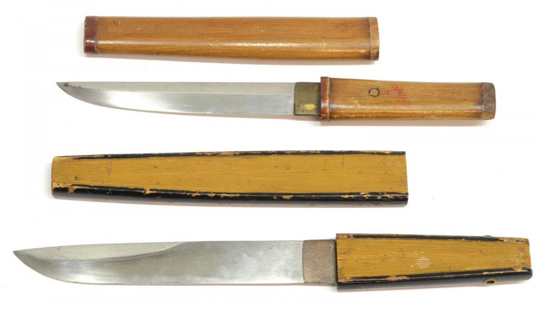 (2) JAPANESE CASED KAIKEN DAGGERS: (lot of 2) Vintage Japanese knives, each with steel blade, wood handle, slipping into a wood case; (1) with case appearing to be a closed fan, blade 6.75"l, overall: 11.75"l; (1) with remnants of red