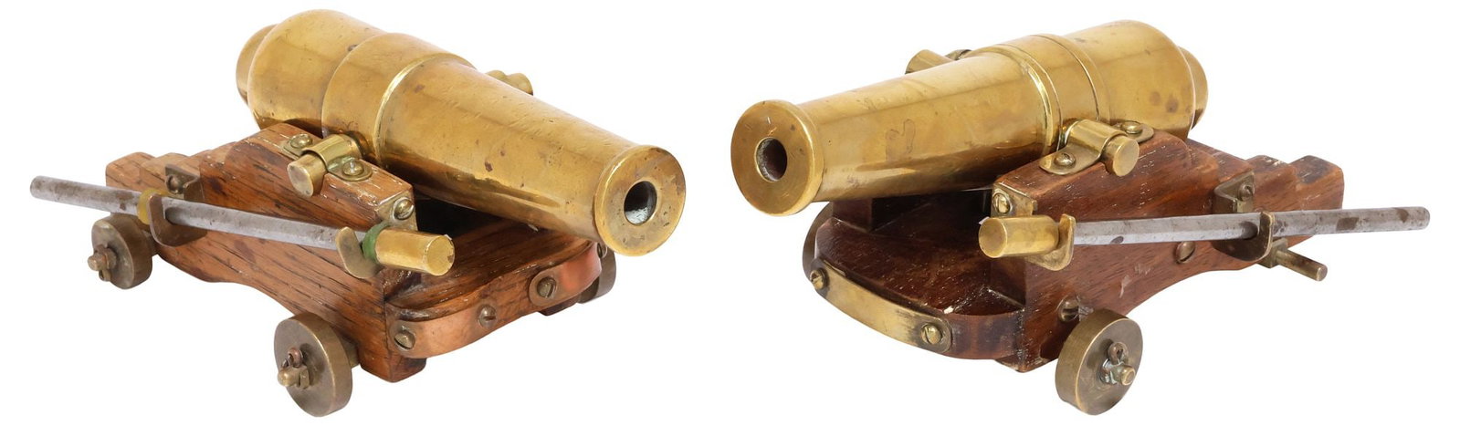 (2) ENGLISH BRASS MINIATURE MODELS OF CANNONS & OAK CARRIAGES: (pair) Decorative English brass models of cannons, each rising on oak carriage, accompanied by ramrod, with functioning wheels, approx 3.5"h, 6.5"w, 4"d, 6lbs total