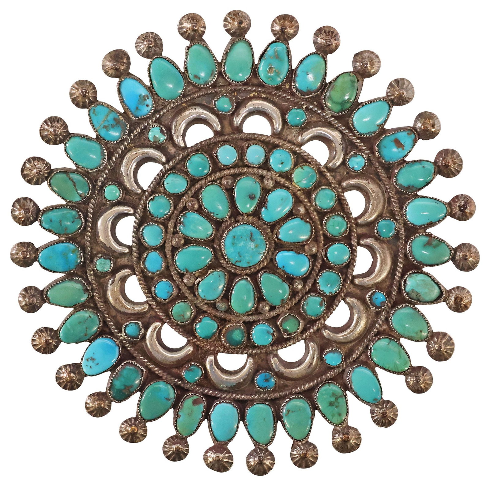 LARGE NATIVE AMERICAN SILVER & PETIT POINT TURQUOISE CLUSTER BROOCH: Substantial Native American silver (content unknown) and turquoise brooch, radiating clusters of petit-point turquoise cabochons, openwork border with crescent moon motifs and twisted rope trim, trade