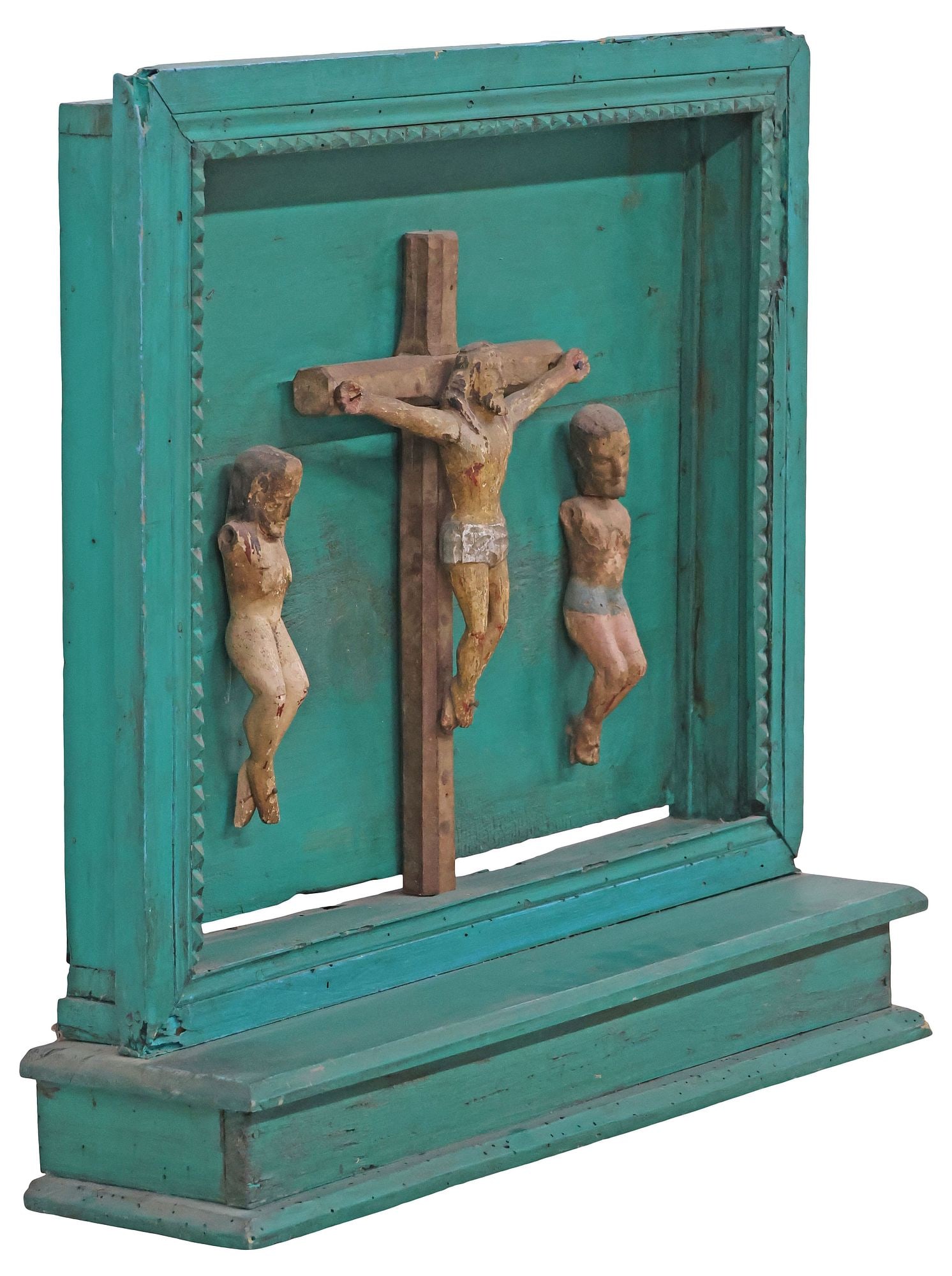 FOLK ART CARVED RELIGIOUS ALTAR NICHO W/ CRUCIFIXION SCENE, MEXICO: Folk art carved and painted wood religious altar niche/ nicho, Puebla, Mexico, 19th c., central figure of Jesus Christ on the cross, flanked by two additional crucified figures, likely the Impenitent 