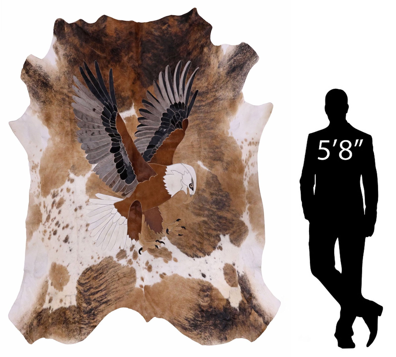 AFRICAN STITCHED COWHIDE PICTURE RUG, EAGLE LANDING, 86" X 81": Decorative African stitched brown and white cowhide animal picture rug, Bald Eagle Landing, depicting an eagle in dynamic pose with wings outstretched, maker's mark on back, approx 86"l, 81"w **Proven