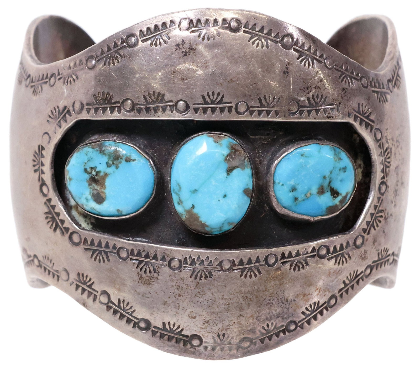 SIGNED NATIVE AMERICAN SILVER & TURQUOISE CABOCHON SHADOWBOX CUFF BRACELET: Native American silver (content unknown) shadowbox cuff bracelet, three turquoise cabochons on a recessed oxidized ground, stamp work trim, interior marked A with an arrow picto mark, approx 2.25"w, i