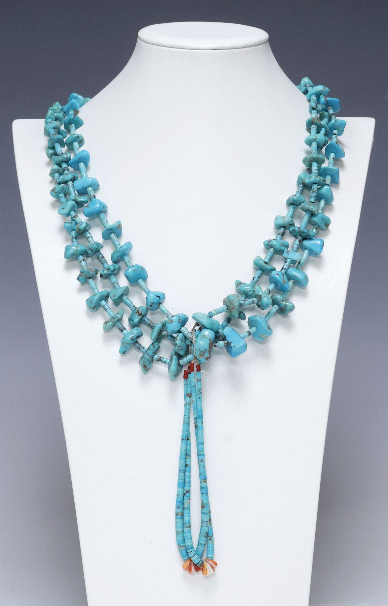 NATIVE AMERICAN PUEBLO TURQUOISE BEADED 3-STRAND JACLA NECKLACE: Native American Pueblo multi-strand beaded Jocla necklace, having three strands of turquoise heishi beads and graduated freeform turquoise nuggets, with shell heishi accents, on woven cord, Jocla pend