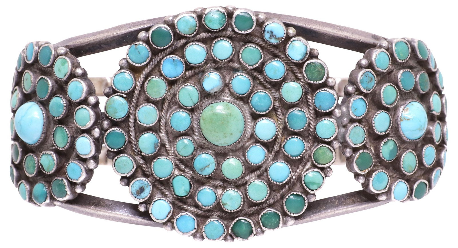 NATIVE AMERICAN SILVER & TURQUOISE CLUSTER CUFF BRACELET: Native American silver (content unknown) cuff bracelet, three medallions with central turquoise cabochon, each encircled by concentric rings of smaller cabochons, totaling (one hundred and three) ston