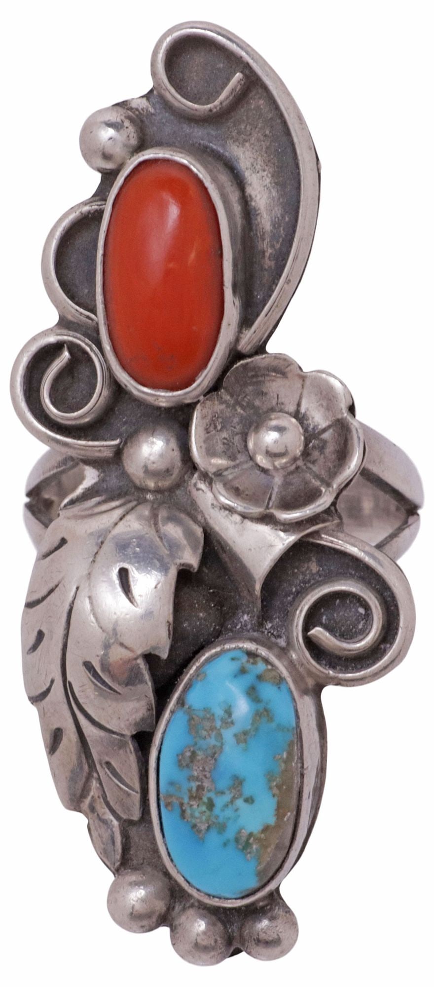PHIL CHAPO NAVAJO NATIVE AMERICAN SILVER TURQUOISE & RED CORAL RING: Native American silver (content unknown) ring, signed Phil Chapo (Navajo, 20th c.), bezel-set red coral and turquoise cabochons, foliate and floral motif, plaque: approx 1.75"l, .75"w, approx size 7, 