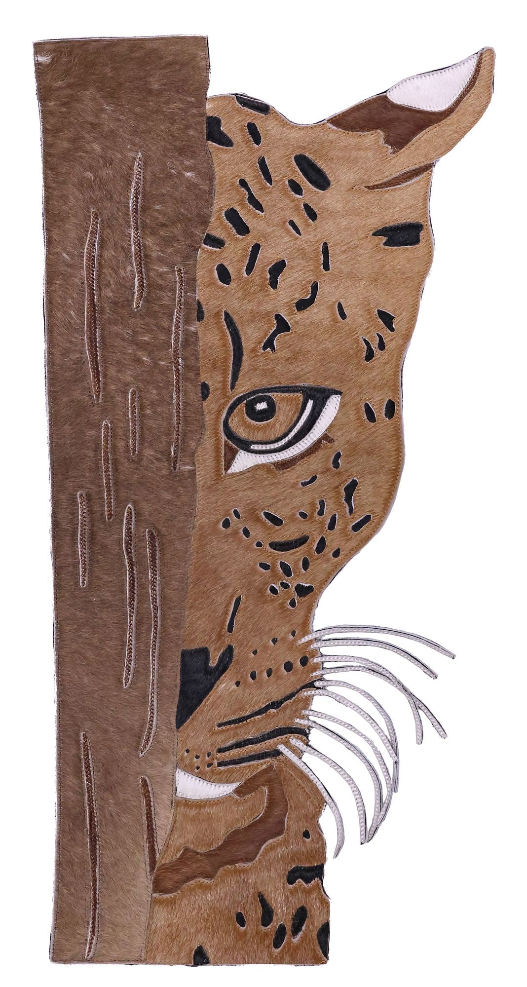 AFRICAN STITCHED COWHIDE WALL-HANGING, HIDING LEOPARD, 31"H: Decorative African stitched hide wall-hanging animal picture, Hiding Leopard, depicting a leopard peeking out from behind a tree, marker's mark on back, approx 31"h, 15.25"w, 1.75lbs **Provenance: Vuk
