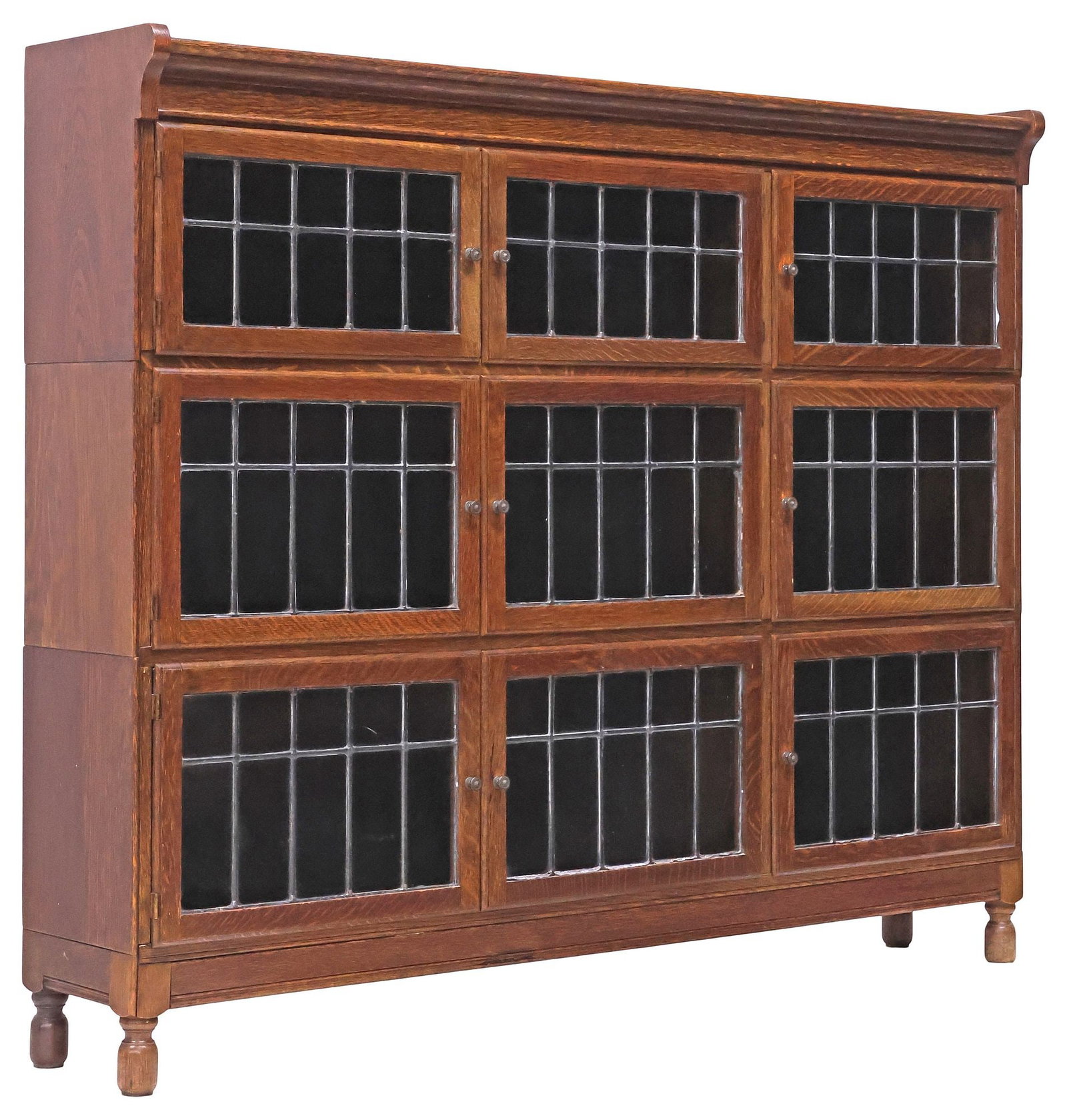 ENGLISH MINTY LIMITED OAK & LEADED-GLASS 3-STACK LAWYER'S BOOKCASE: English Edwardian oak barrister's/ lawyer's stacking bookcase, Minty Limited, Oxford, early 20th c., three stacking tiers, each with three doors having leaded glass panes, on cylindrical supports, ret