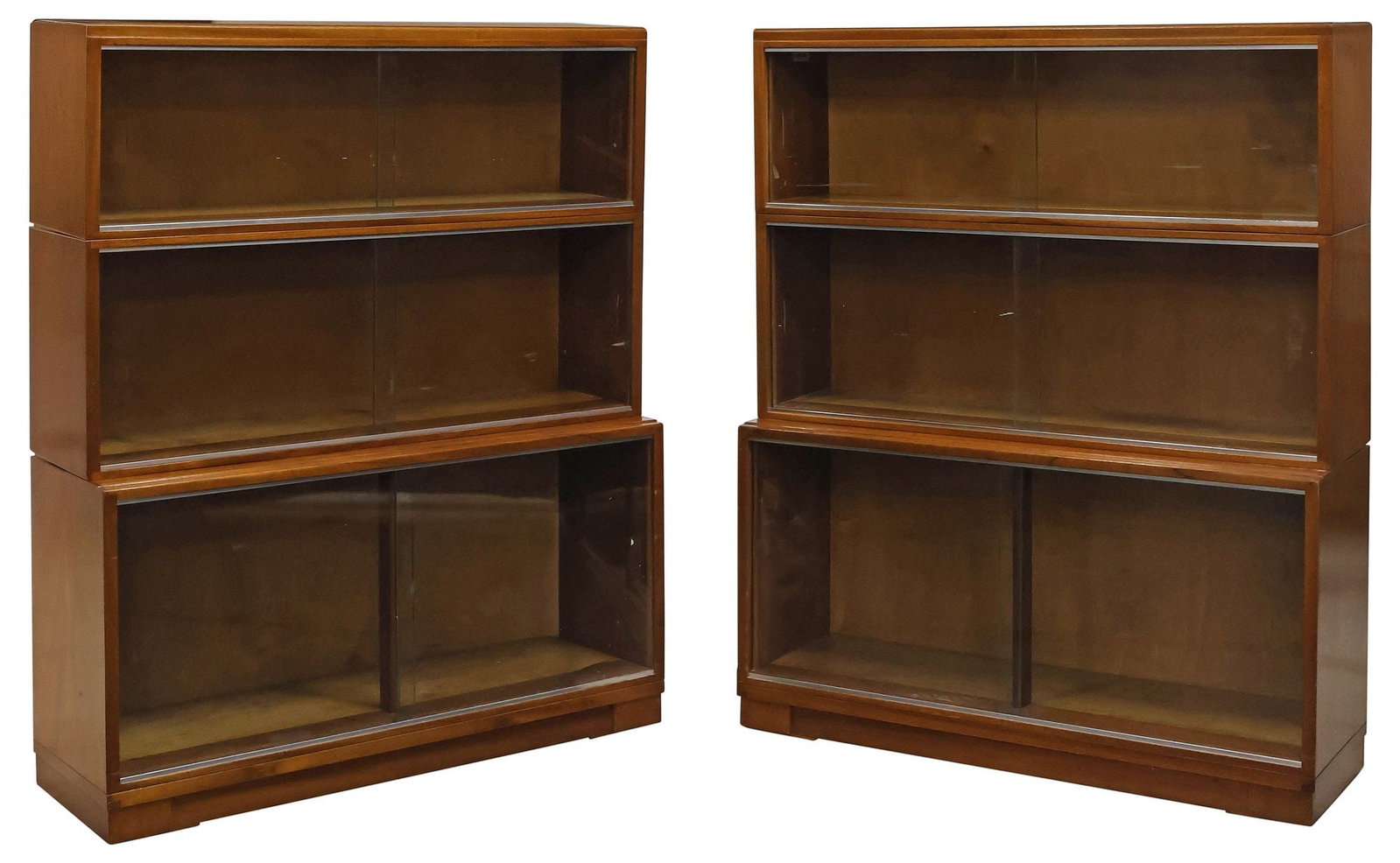 (2) ENGLISH GLAZED MAHOGANY 3-STACK BARRISTER'S BOOKCASE: (pair) English mahogany lawyer's stacking bookcases, early 20th c., each comprising three tiers with sliding glass doors, on platform base, approx 42.75"h, 35.25"w, 11.5"d