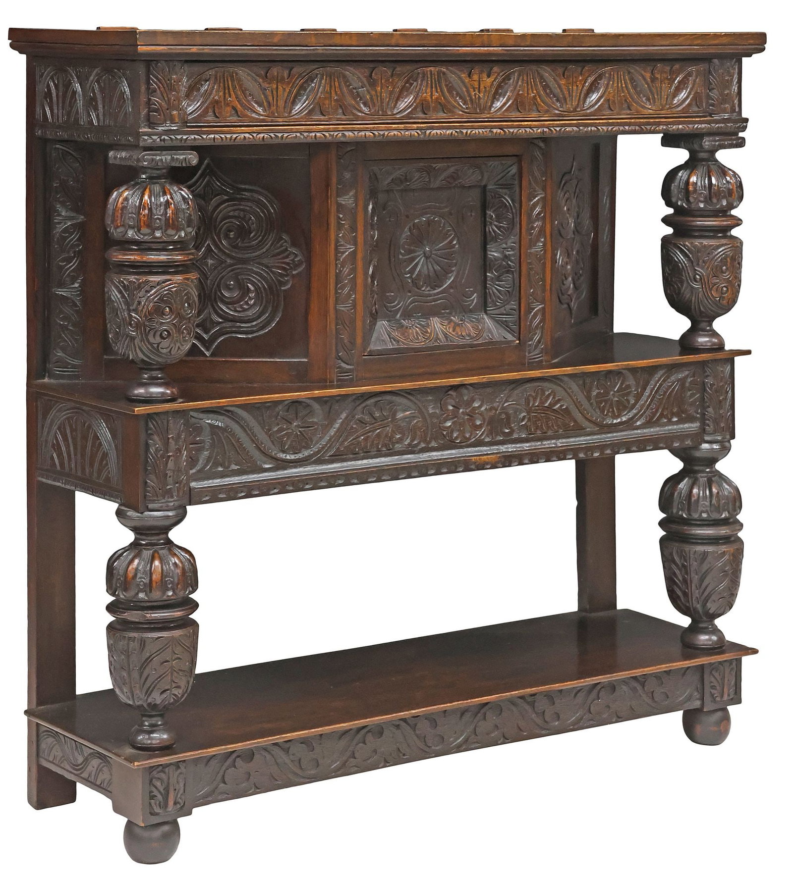 ENGLISH JACOBEAN STYLE CARVED OAK BUFFET / SERVER, 19TH C.: English Jacobean style carved oak buffet, late 19th c., two-tier case with carved foliates and stylized scrollwork, fitted with central cabinet door, enclosing open interior storage, fluted bulbous su