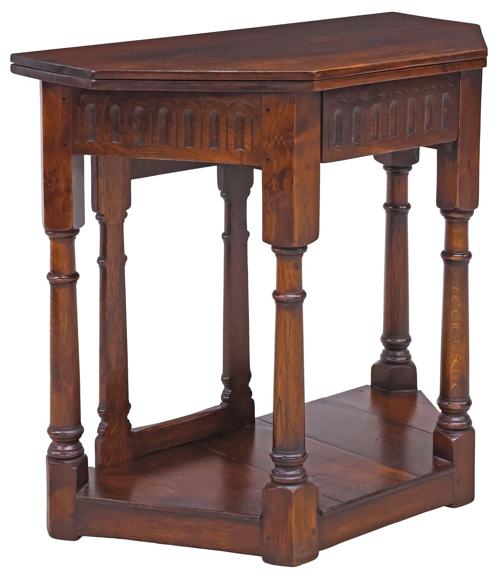 ENGLISH JACOBEAN STYLE OAK FLIP-TOP GATELEG CONSOLE TABLE: English Jacobean style oak flip-top console table, 20th c., having canted rectangular flip-top opening to an octagonal top, above single drawer, rising on turned supports with fold-out gate leg, endin