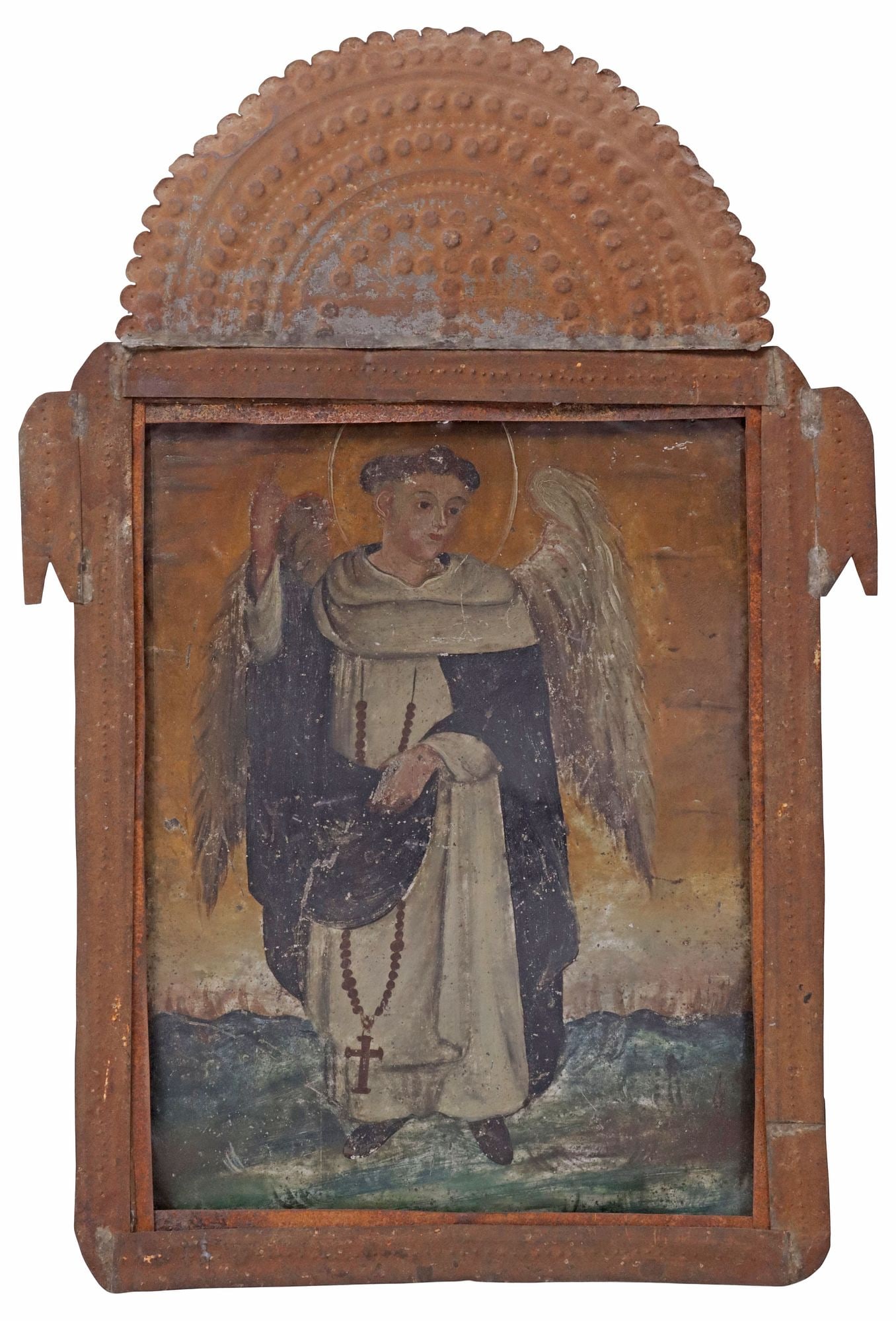 FRAMED OIL ON TIN RETABLO, SAINT VINCENT FERRER, MEXICO: Framed oil on tin retablo, Saint Vincent Ferrer, Mexico, 19th c., depicting the winged Saint in a Dominican habit wearing a rosary while raising is right hand to the heavens, housed in embossed tin ni