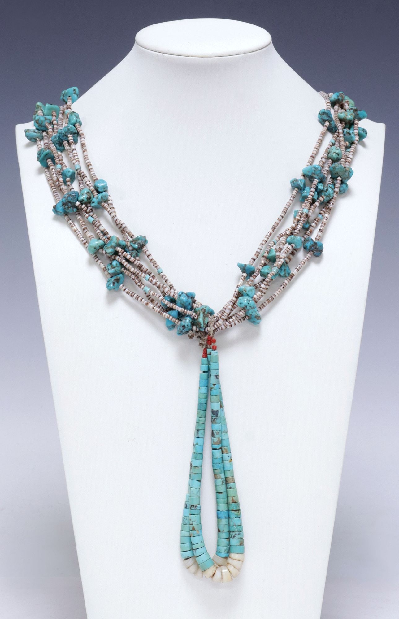 NATIVE AMERICAN PUEBLO TURQUOISE & SHELL HEISHI BEAD MULTI-STRAND JACLA NECKLACE: Native American Pueblo beaded Jocla necklace, seven-strand shell heishi bead necklace with interspersed turquoise nuggets, on tied cord Jocla pendant with tapering shell beads, necklace: approx 30"l, 