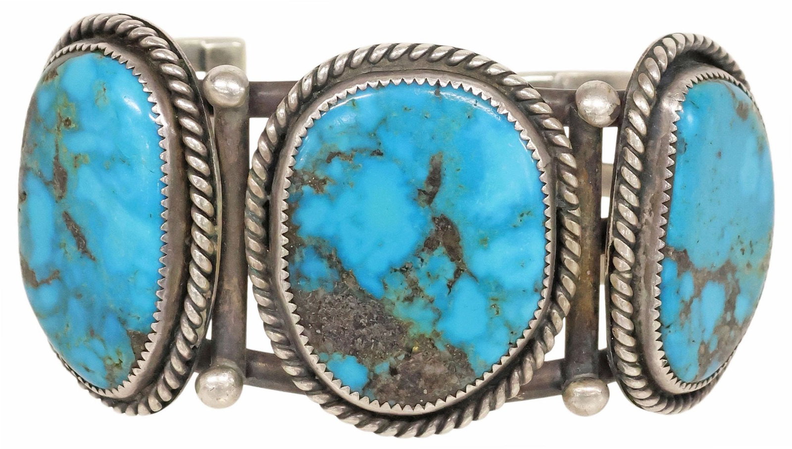 NATIVE AMERICAN SILVER & TURQUOISE SPLIT SHANK CUFF BRACELET: Native American silver (content unknown) cuff bracelet, split shank cuff with three large bezel-set turquoise stones, small metallic flecked inclusions, serrated and rope twist trim, accented by space