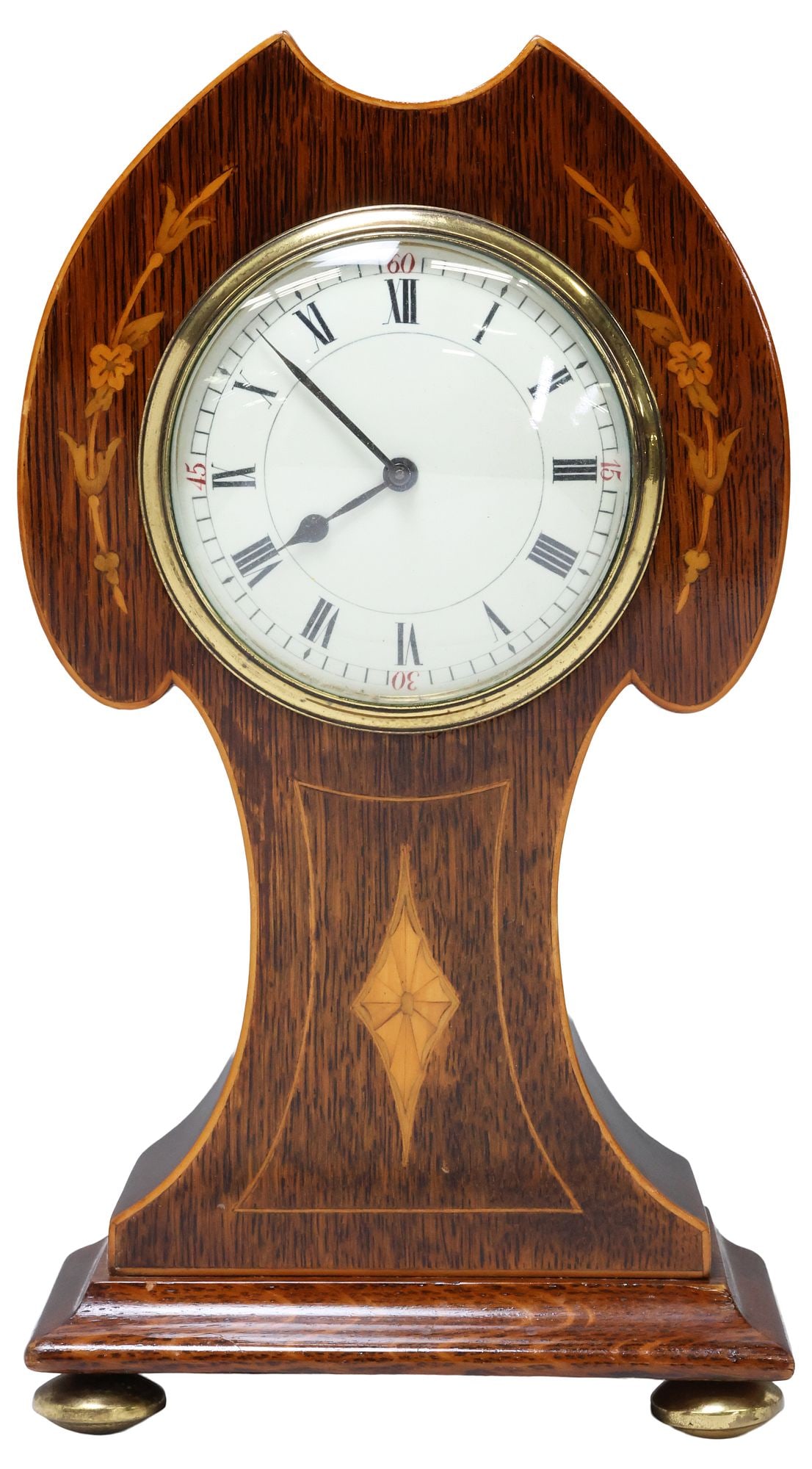 ENGLISH EDWARDIAN INLAID MAHOGANY BALLOON-CASE MANTEL CLOCK: English Edwardian inlaid mahogany mantle clock, early 20th c., shaped balloon-style case with foliate marquetry and stringwork trim, centering white dial with Roman numeral hour markers, mechanical wi
