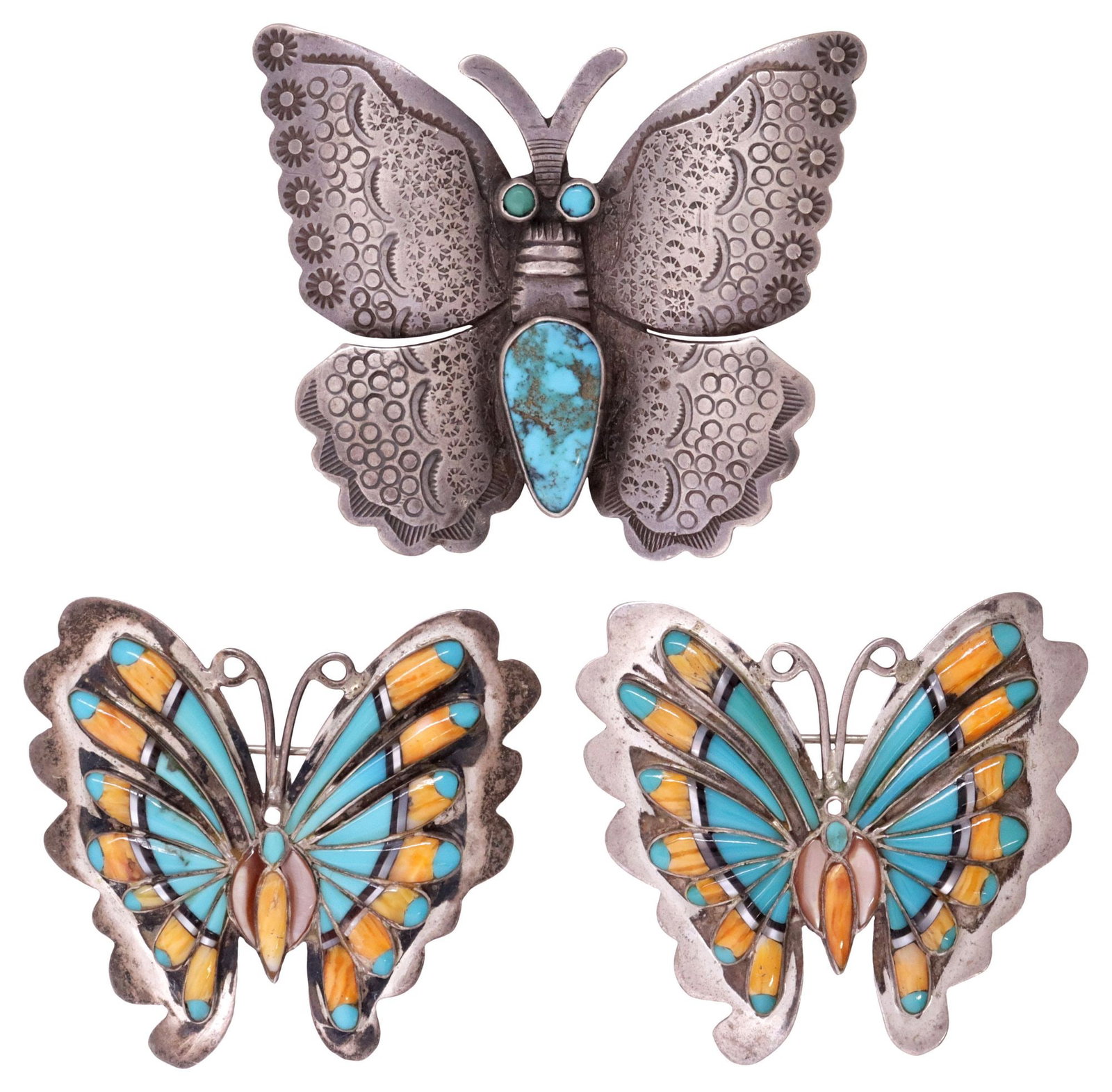 (3) NATIVE AMERICAN SILVER, TURQUOISE & GEMSTONE BUTTERFLY BROOCHES: (lot of 3) Native American silver and gemstone brooches, each in the form of a winged butterfly, including: (2) sterling silver brooches, channel-inlaid with turquoise, spiny oyster, shell, and jet, m