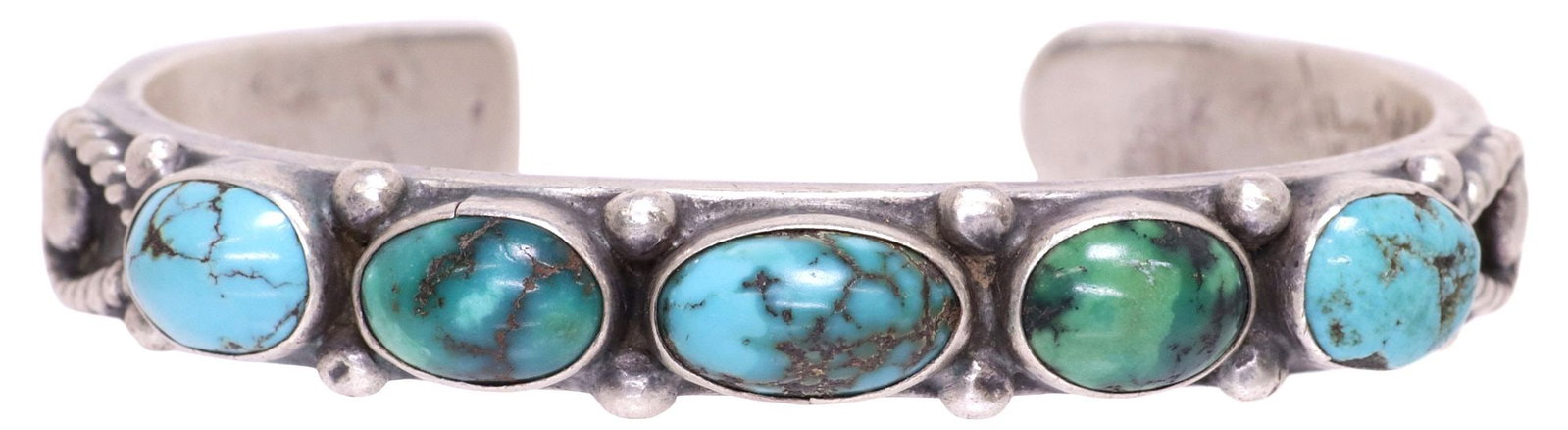 NATIVE AMERICAN SILVER STAMPWORK & TURQUOISE CABOCHON NARROW CUFF: Native American silver (content unknown) narrow cuff bracelet, (five) turquoise cabochons, flanked by beaded accents, over stamp work band, unmarked, approx 0.5"w, interior: approx 5.5"l, gap: approx 