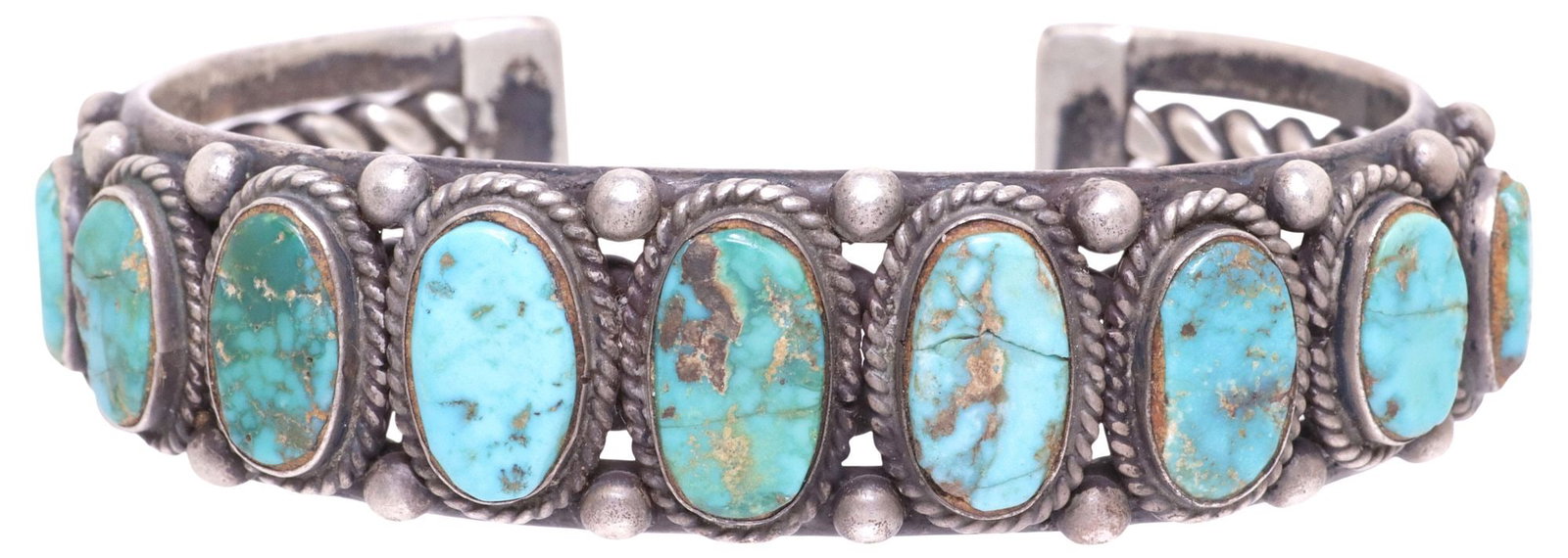 NATIVE AMERICAN SILVER & TURQUOISE CABOCHON CUFF BRACELET: Native American silver (content unknown) cuff bracelet, (nine) turquoise cabochons, with beaded accents, on an openwork wire and solid band, unmarked, approx 0.75"w, interior: approx 6"l, gap: approx 