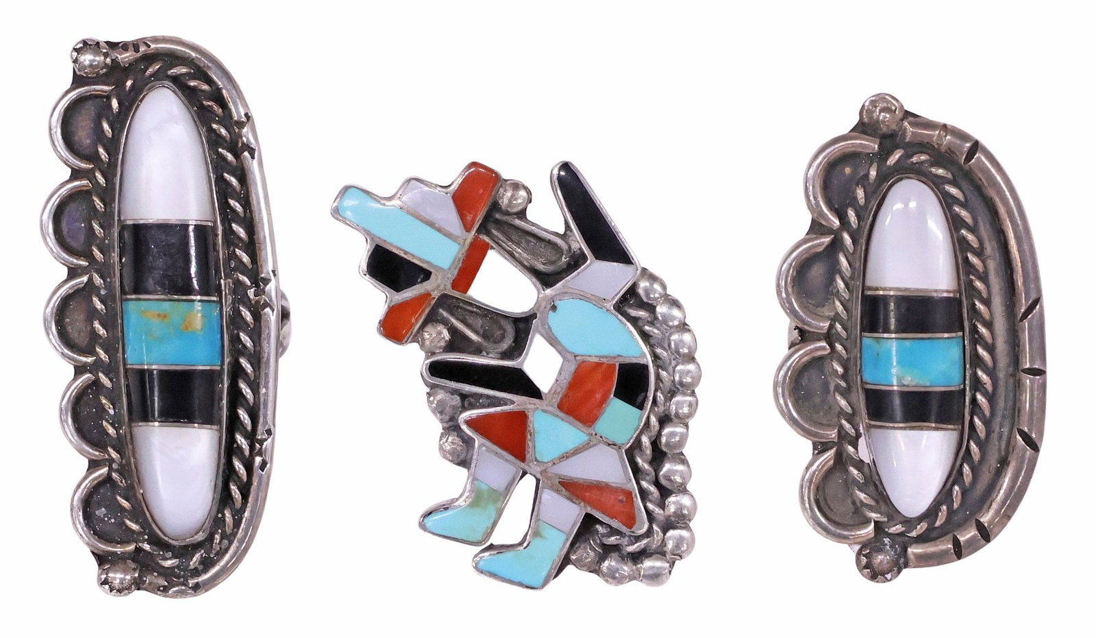 (3) NATIVE AMERICAN ZUNI SILVER CHANNEL-INLAID TURQUOISE, CORAL & MOP RINGS: Native American channel-inlaid silver (content unknown) rings, Zuni, including: (1) in the form of the Rainbow Man, beaded trim, size 7.25, plaque: approx 1 5/8"l, (2) with central turquoise and shell