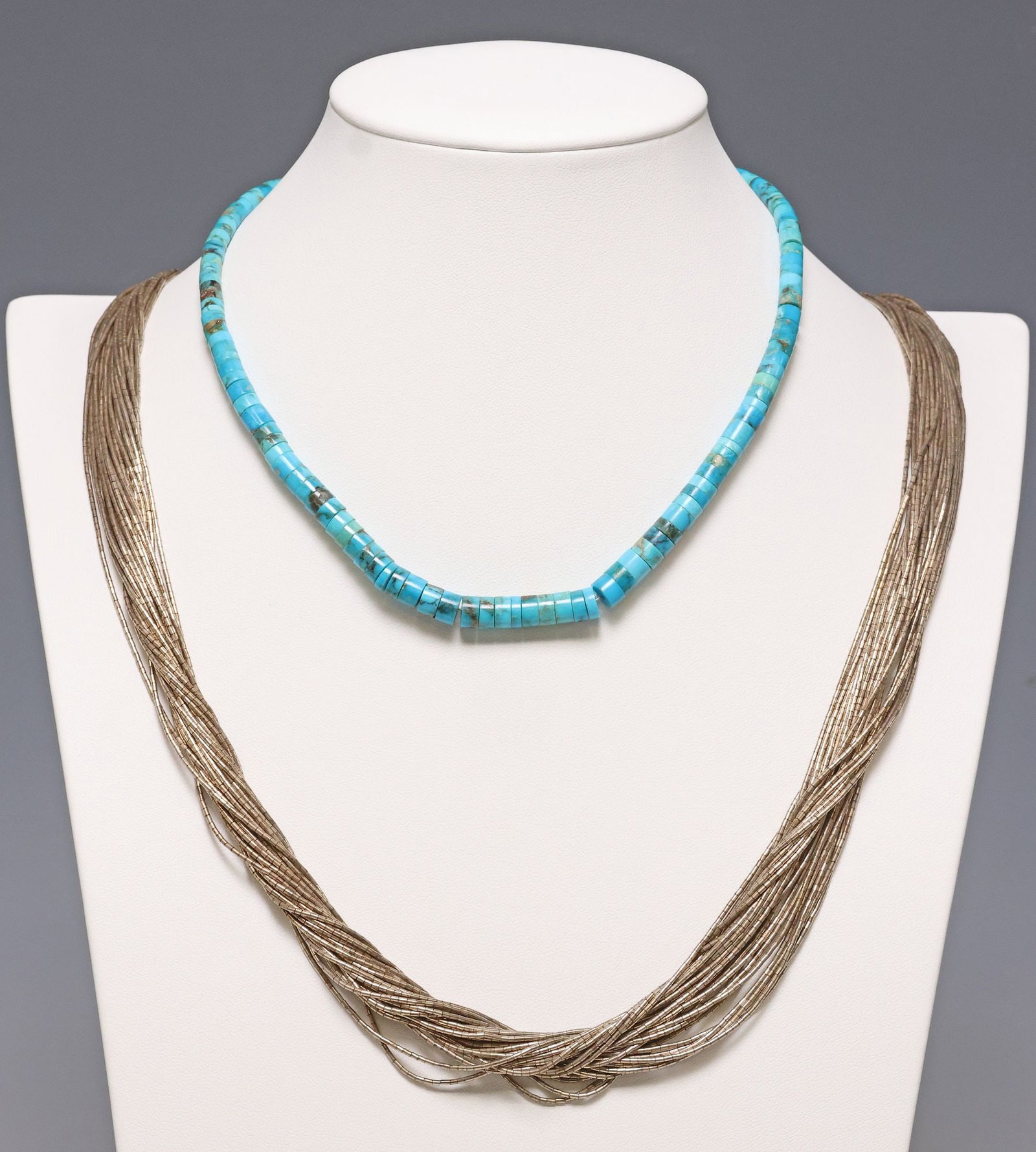 (2) NATIVE AMERICAN 30-STRAND LIQUID SILVER & BEADED TURQUOISE NECKLACES: (lot of 2) Native American beaded necklaces, including: (1) silver (content unknown) thirty-strand liquid silver necklace, conical findings with stampwork motifs, hook closure, unmarked, approx 27"l; 